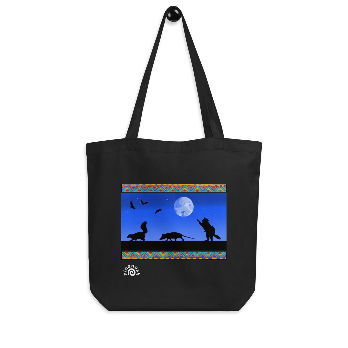 Black trash cats tote bag from Nina's Funky Shop by ninanush - A funky colorful tote bag for animal lovers and quirky accessory enthusiasts of all kinds. It's a unique design of a raccoon, opossum, and skunk taking a night stroll with bats flying in the starry sky. This trash cats tote is is made of 100% organic cotton and the design is hand drawn by Nina and made just for you. Stand out with this eye catching tote or give it as a funny gift for your favorite animal loving friend.