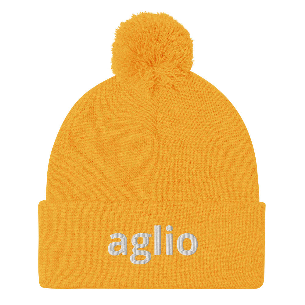 Yellow aglio beanie from Nina's Funky Shop by ninanush - An Italian garlic beanie for aglio lovers. This aglio hat is a classic pom pom beanie with a funny Italian word embroidery. The perfect cozy hat for Italians, garlic enthusiasts and foodies of all kinds. Stand out and share your love of garlic in this Italian garlic hat or give it as a cute gift for an Italian foodie.