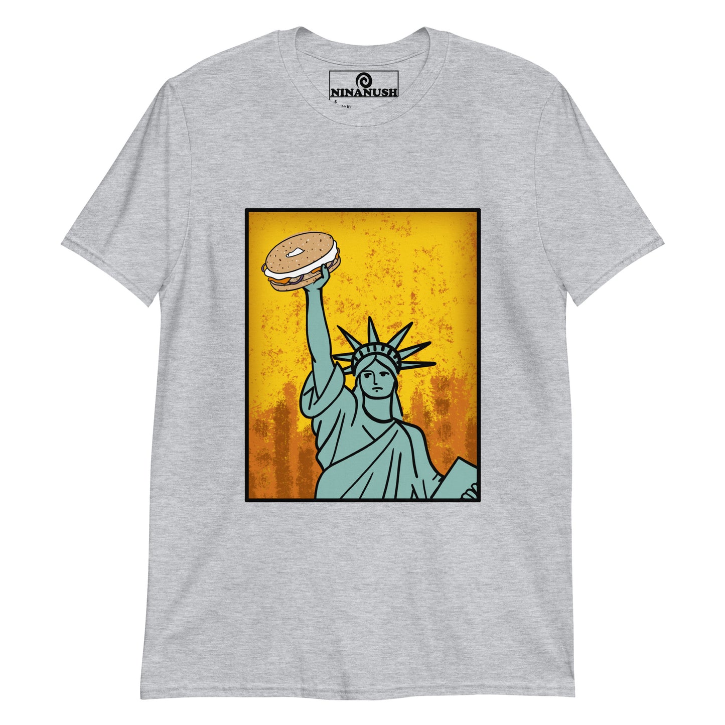 Light gray bagel lover graphic tee - Funky Statue of Liberty T-shirt. Eat bagels in style in a funny food t-shirt for bagel lovers. It's a colorful graphic tee with a totally unique hand drawn design of the Statue of Liberty holding a bagel. It's just what every bagel enthusiast needs. Make a statement or give it as a funny gift for bagel lovers.