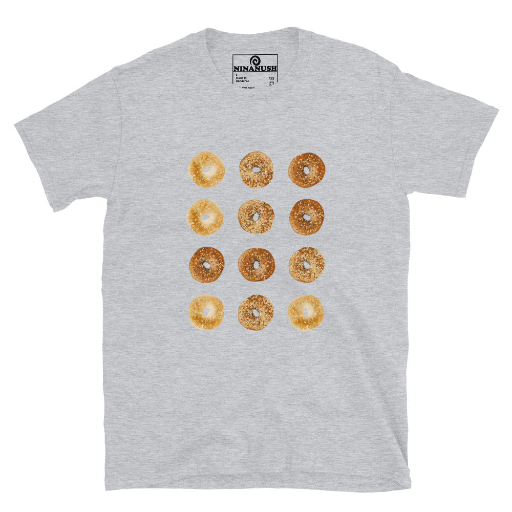 A unique bagel t-shirt with a dozen bagels—a must-have shirt for bagel lovers and foodies. Make a funny statement and eat bagels with this artsy and unique, bagel streetwear shirt. Perfect for enjoying bagel sandwiches or expressing your love for bagels. This shirt says "I love bagels and I don't care who knows it."