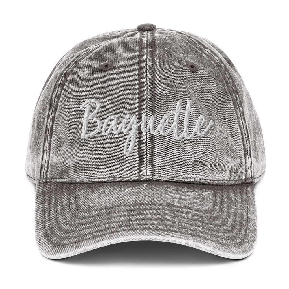 Gray French baguette hat from Nina's Funky Shop by ninanush - Everyone loves a Baguette. Show your love for the classic French bread in this funny foodie dad hat. It's has a stylish washed out material and "Baguette", embroidered on the front. It's a unique accessory that gives personality to your everyday outfit. Stay funky and eat baguettes in this baguette enthusiast hat.
