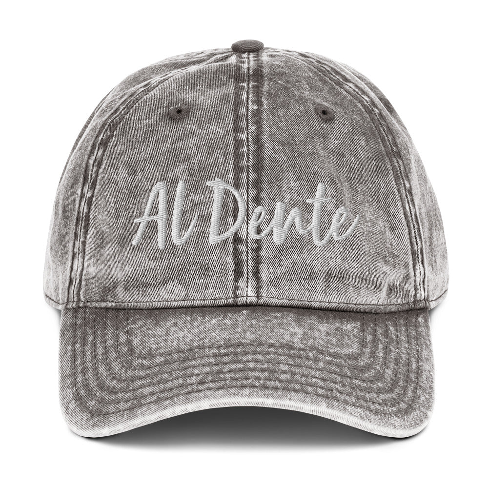 Gray Al Dente Hat - This Al Dente Hat is perfect for pasta lovers and foodies of all kinds. It's comfortable, has an adjustable closure, and comes in a variety of colors with "Al Dente", expertly embroidered on the front. Celebrate your favorite foods in our funky foodie clothing and accessories. Designed by Nina and made just for you!