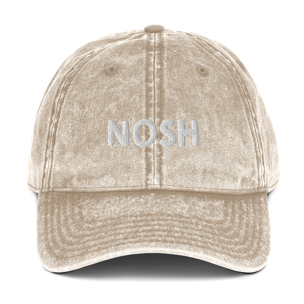 Khaki nosh hat - A nosh hat with a simple text embroidery, vintage-style faded material and it comes in a variety of colors. It's a funny dad hat for foodies or a gift for noshers and food enthusiasts. Nosh on your favorite foods in this yiddish word hat. It's a perfect hat for everyday wear and a unique dad hat for snack lovers.