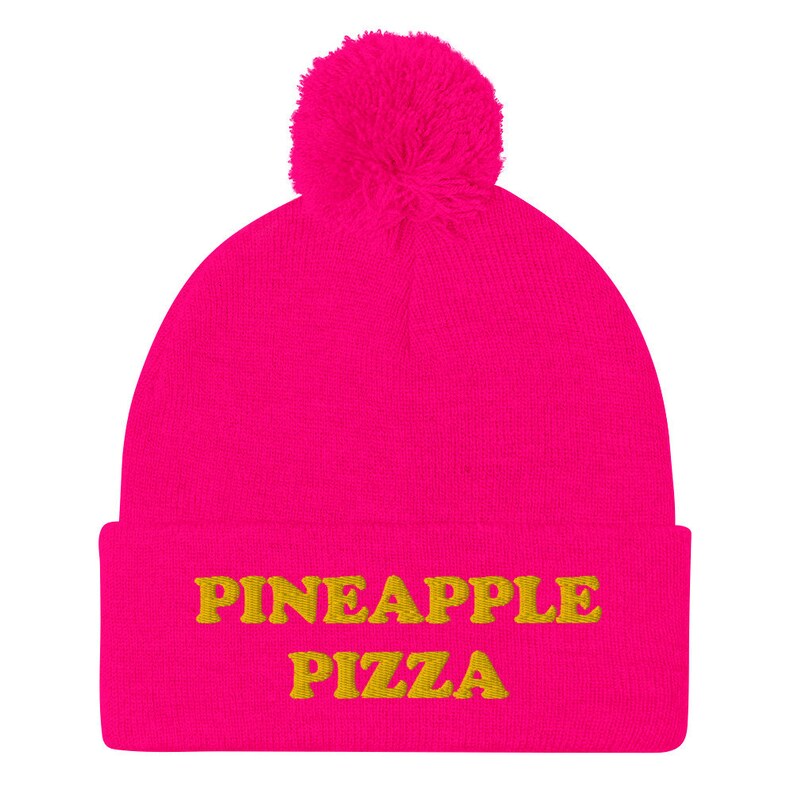 Hot pink pineapple pizza hat - Are you in the pineapple pizza club? Eat pineapple pizza in style in a funny foodie beanie for pizza lovers. It's a unisex embroidered beanie for pineapple pizza enthusiasts. If you love pineapple pizza, this weird foodie hat is a must have or give this warm and cozy hat as a funny gift for pineapple pizza people.