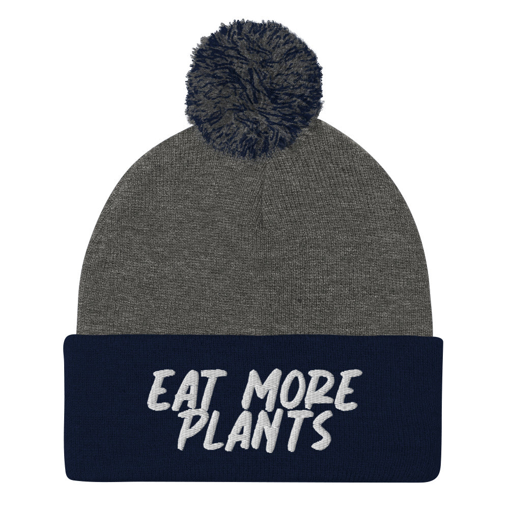 Eat more plants beanie! For the animals, for the planet, and for your health. This warm and meaningful hat has "eat more plants" embroidered in white and a pom pom on top. A unique gift for vegans and activists. Shop garlic hats, vegan friendly graphic tees, eco friendly hoodies and more. All unique and original designs.