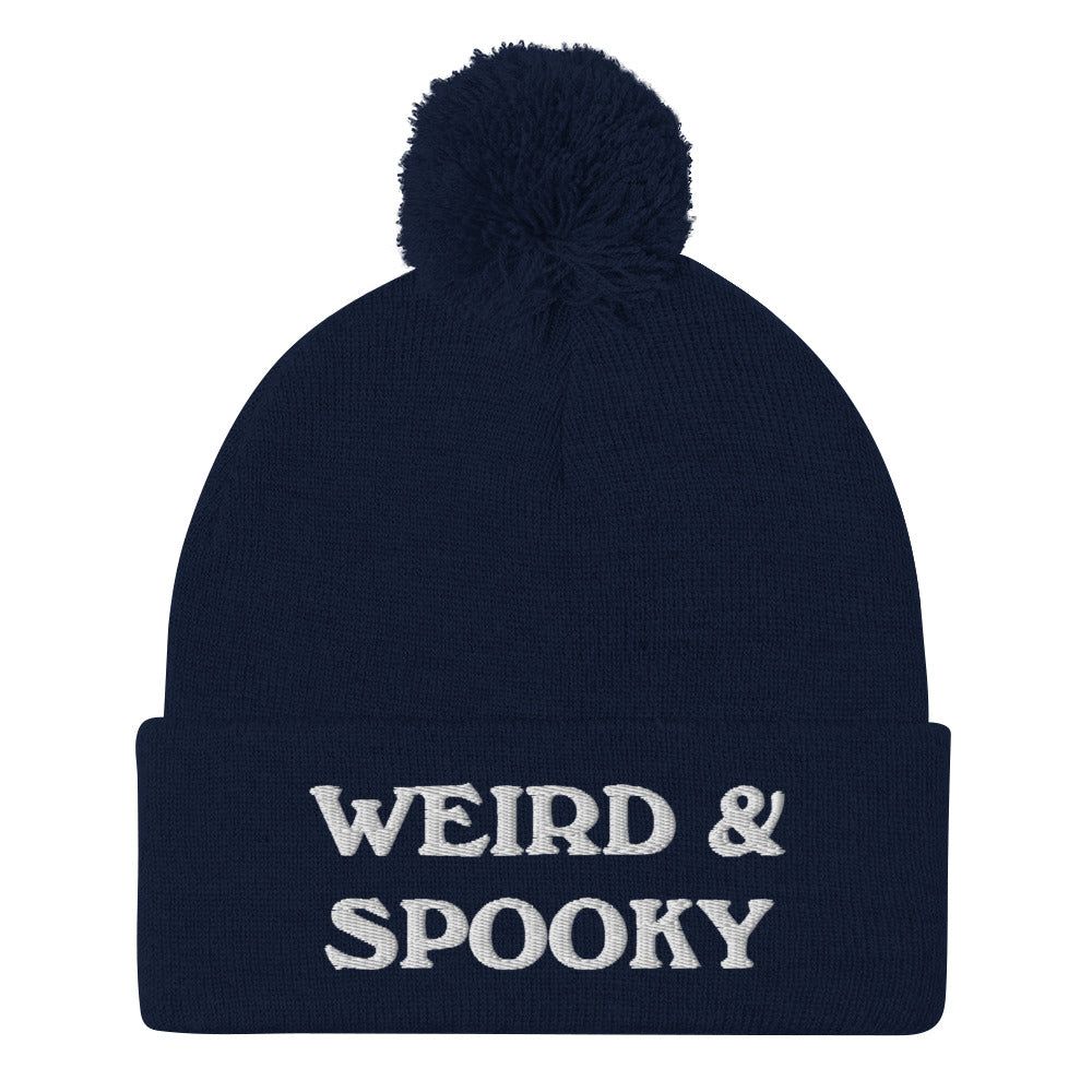 Navy blue and white weird and spooky beanie hat with pom pom - Stay weird and spooky in this classic beanie with a pom pom on top. It's cute and cozy and just a little weird. So, celebrate your weirdness and individuality in our funky clothing and accessories. Be weird, be spooky, and be yourself in these colorful and unique beanies.