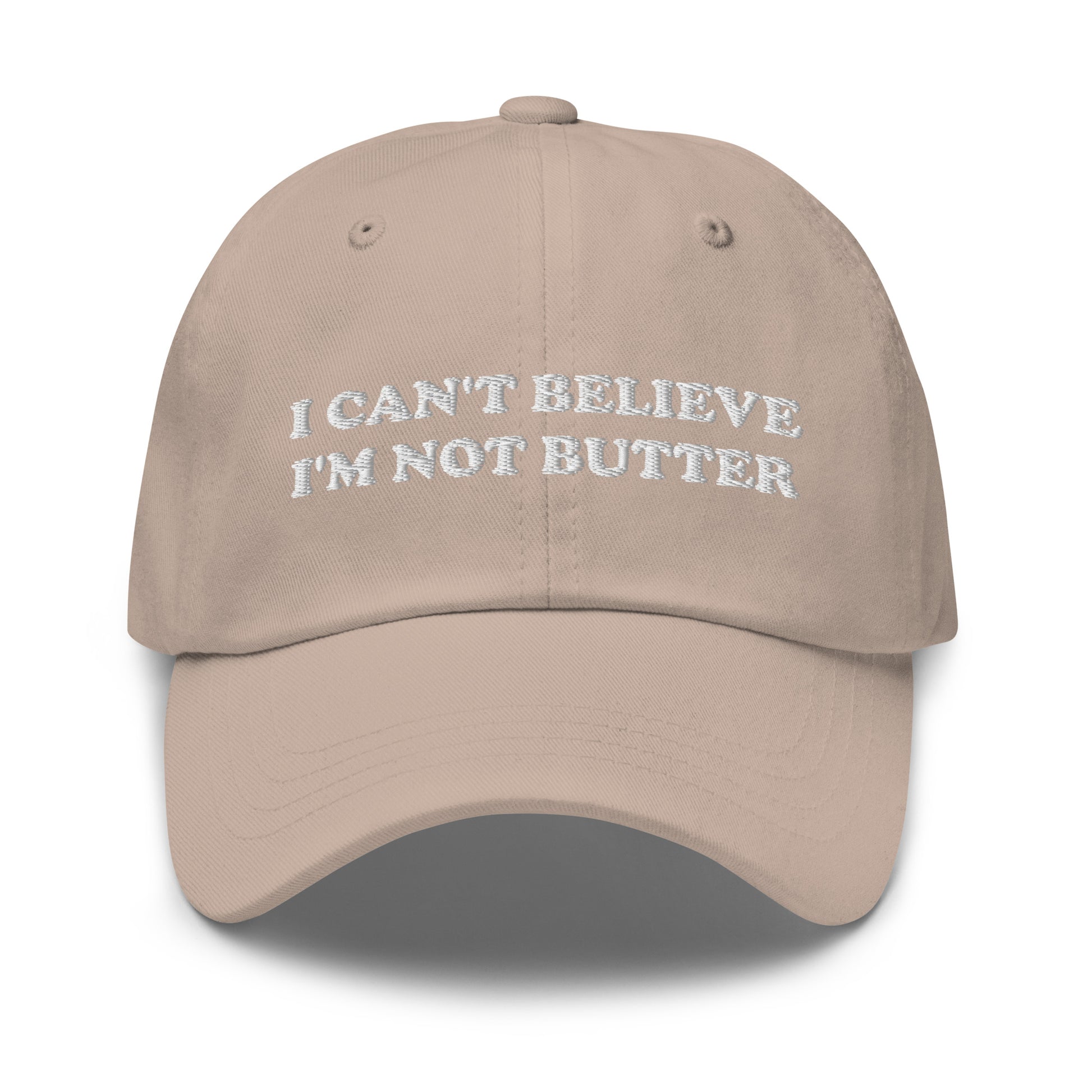 Stone I Can't Believe I'm Not Butter Hat - Our I can't believe I'm not butter hat is comfortable, comes in a variety of colors and has an adjustable closure. It's a classic dad hat with a funny saying, expertly embroidered on the front. Perfect for everyday streetwear and sure to turn heads and have everyone asking, "Where'd you get that hat?"