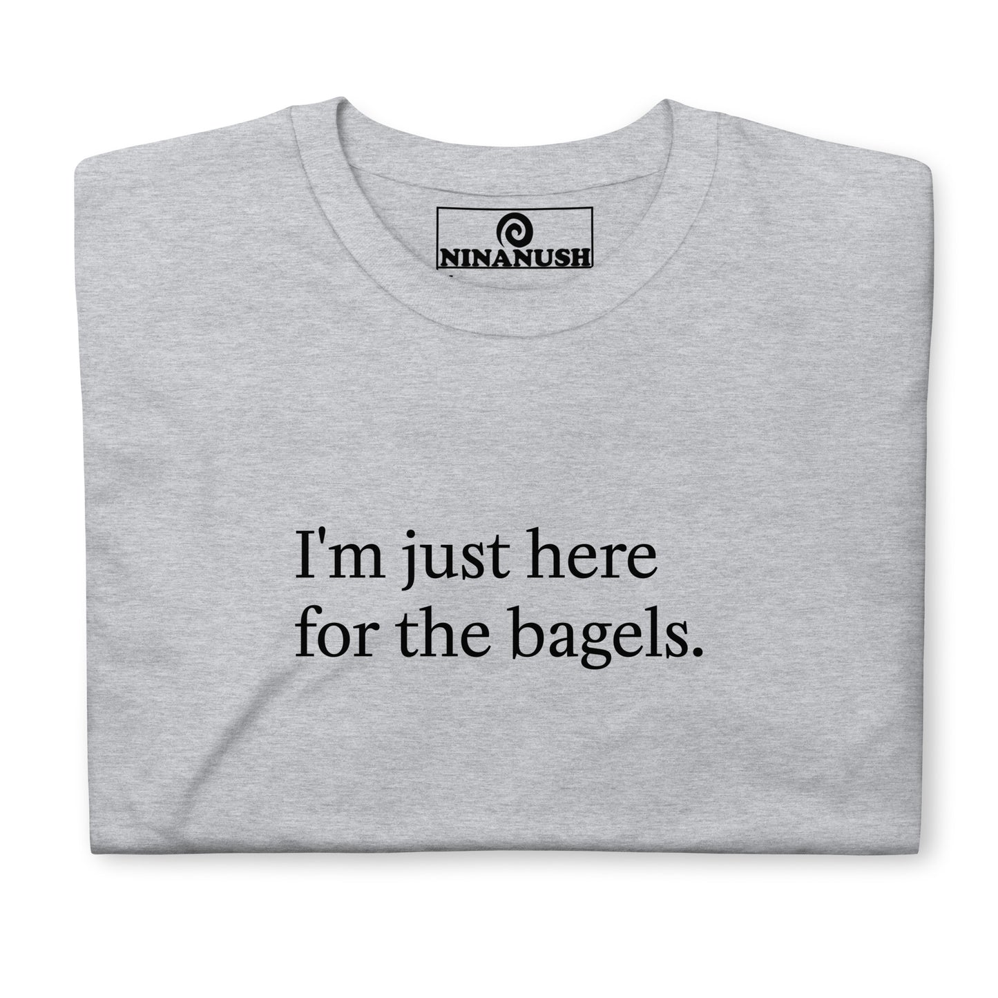 Gray bagel saying t-shirt - "I'm just here for the bagels." This bagel enthusiast t-shirt is a comfortable classic tee with a funny bagel quote on the front. Make a statement and eat bagels in this weird shirt for bagel lovers and foodies of all kinds. Great for everyday streetwear or a gift for your favorite bagel antisocial lover enthusiast. Celebrate your favorite foods in our funky foodie clothing and accessories. 