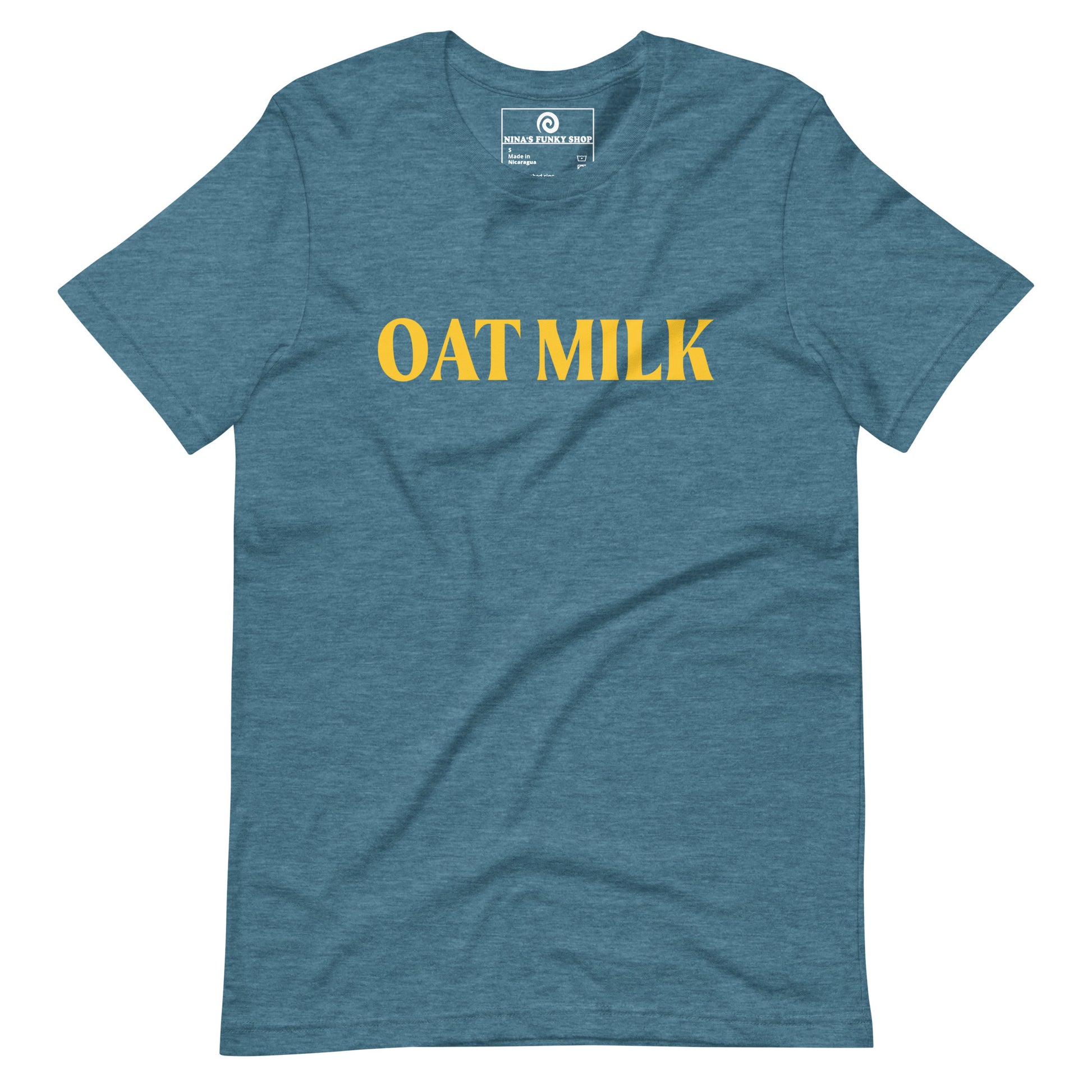 Teal Oat Milk T-shirt - Are you an oat milk enthusiast? Looking for a funny gift for a dairy free friend? Our Oat Milk T-shirt is soft, comfortable and just what you need. It's a unisex t-shirt that comes in a variety of colors with "oat milk", on the front. A funny t-shirt for plant based babes and foodies of all kinds. Celebrate your favorite foods in our funky foodie apparel. Designed by Nina and made just for you!