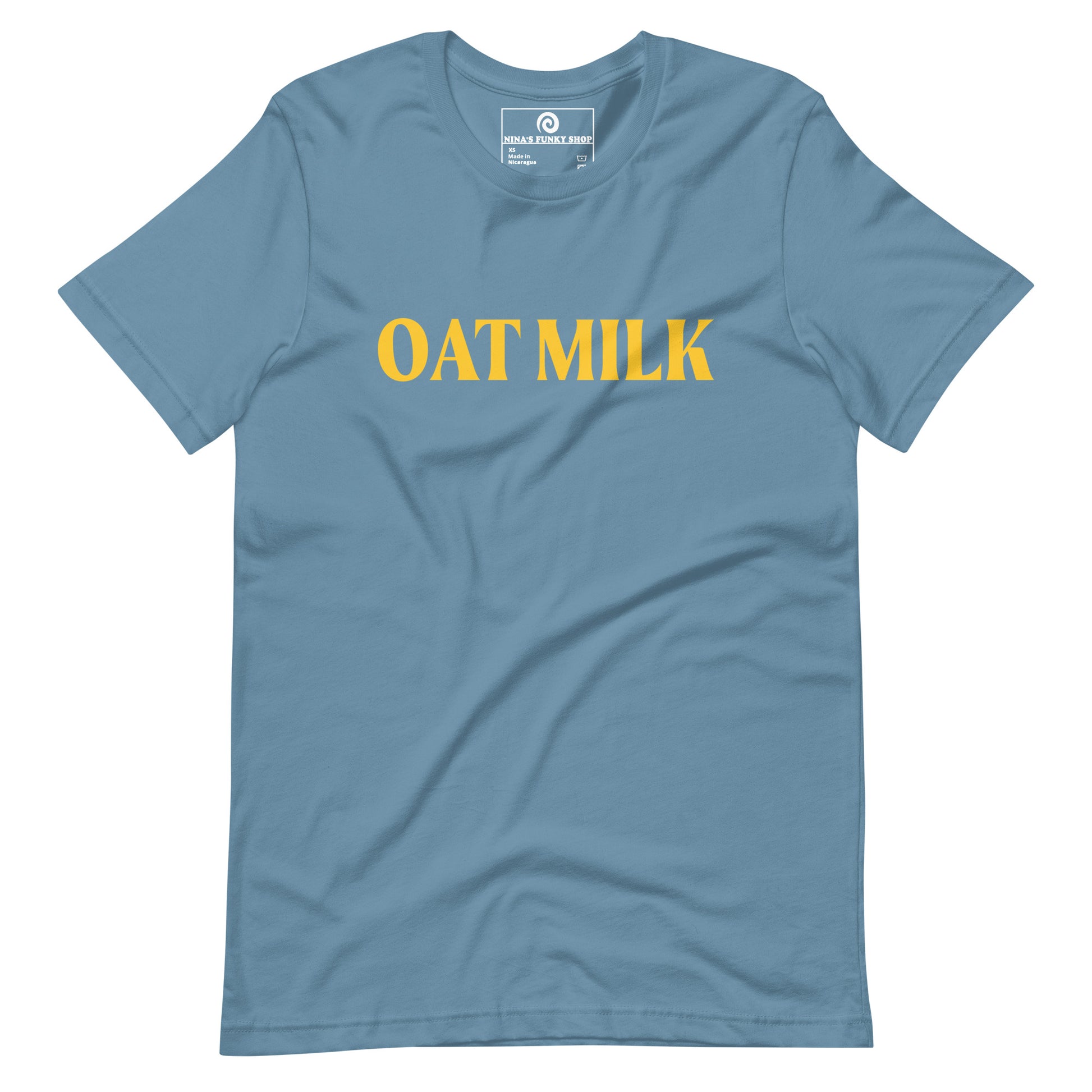 Steel Blue Oat Milk T-shirt - Are you an oat milk enthusiast? Looking for a funny gift for a dairy free friend? Our Oat Milk T-shirt is soft, comfortable and just what you need. It's a unisex t-shirt that comes in a variety of colors with "oat milk", on the front. A funny t-shirt for plant based babes and foodies of all kinds. Celebrate your favorite foods in our funky foodie apparel. Designed by Nina and made just for you!