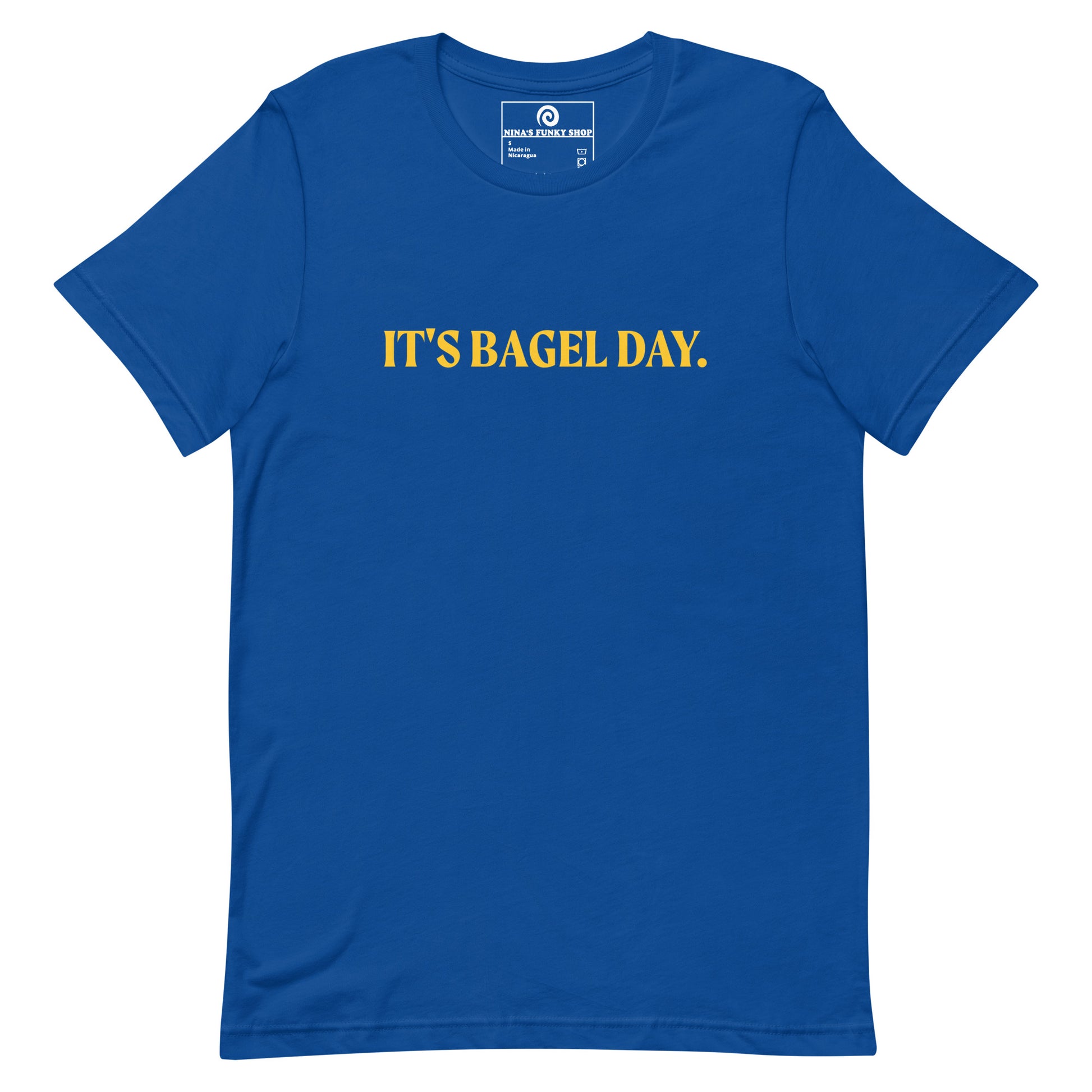 Blue It's Bagel Day T-Shirt - Are you a bagel enthusiast? Looking for a funny gift for a fellow bagel lover? Every day is bagel day in our "It's Bagel Day T-shirt". It's a soft and comfortable, unisex t-shirt that comes in a variety of colors with a funny bagel saying, expertly printed on the front. Eat your favorite bagels and make a statement. Celebrate your favorite foods in our funky foodie apparel.