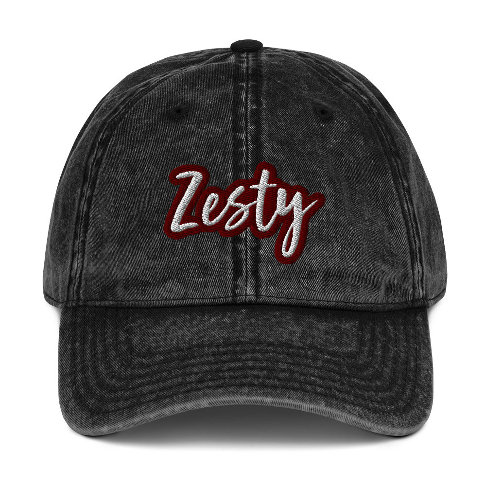 Black zesty hat - The Zesty Dad Hat, a perfect accessory to add a touch of personality to your outfit. With a vintage-style faded look, a red and white unique embroidery, and an adjustable strap, this quirky dad hat was made just for you. Wear this colorful dad hat as everyday wear or give this hat as a funny gift to a zesty friend.