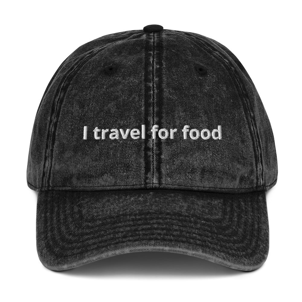 Black I Travel For Food Hat - $1000 flight to Thailand for $2 pad Thai? Yes please! Our "I travel for food" hat is comfortable and has an adjustable closure. It comes in a variety of colors with a funny travel saying for foodies, expertly embroidered on the front. This dad hat is perfect for travelers and foodies alike.