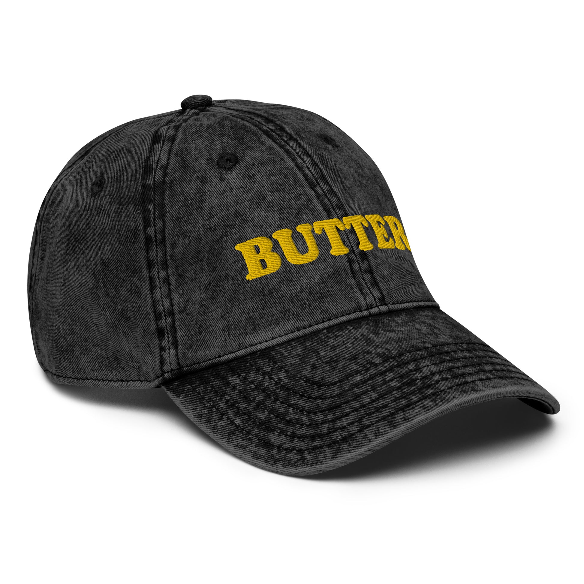 Black Butter Dad Hat - Do you love butter? This butter hat is just what you need. It's comfortable, has an adjustable closure, and comes in a variety of colors with "butter", expertly embroidered on the front. Add a little personality to your everyday style with this funny foodie hat. Perfect for butter lovers and beyond. Celebrate your favorite foods in our funky foodie clothing and accessories.