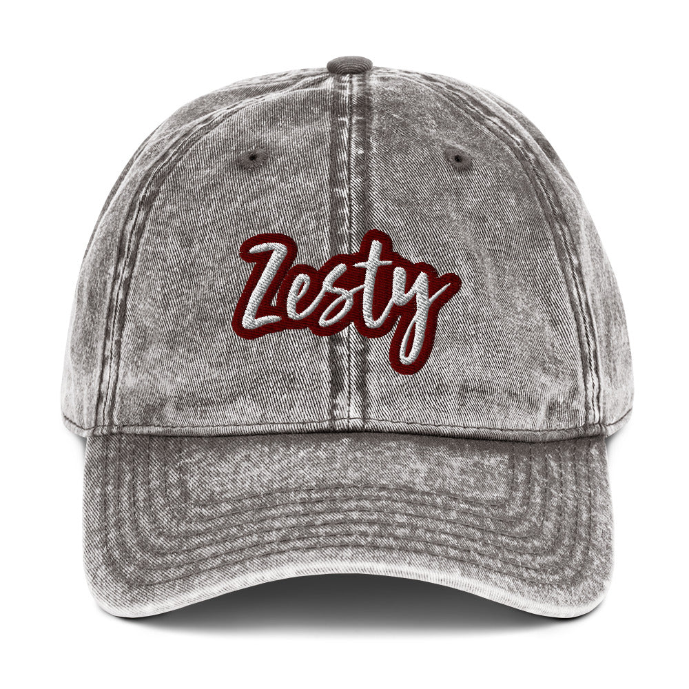 Gray zesty dad hat - The Zesty Dad Hat, a perfect accessory to add a touch of personality to your outfit. With a vintage-style faded look, a red and white unique embroidery, and an adjustable strap, this quirky dad hat was made just for you. Wear this colorful dad hat as everyday wear or give this hat as a funny gift to a zesty friend.