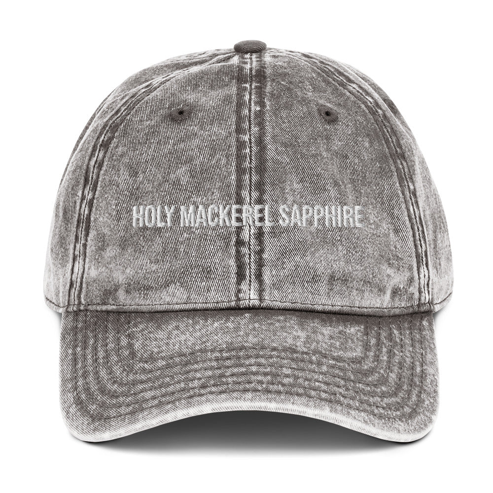 Gray holy mackerel sapphire dad hat from Nina's Funky Shop by ninanush - HOLY MACKEREL SAPPHIRE! This vintage style dad hat comes in a variety of colors with the words "Holy Mackerel Sapphire" expertly embroidered on the front. It's a comfortable, vintage style dad hat with a funny saying. Add a little personality to your everyday outfit with this weird dad hat that's designed by Nina and made just for you.