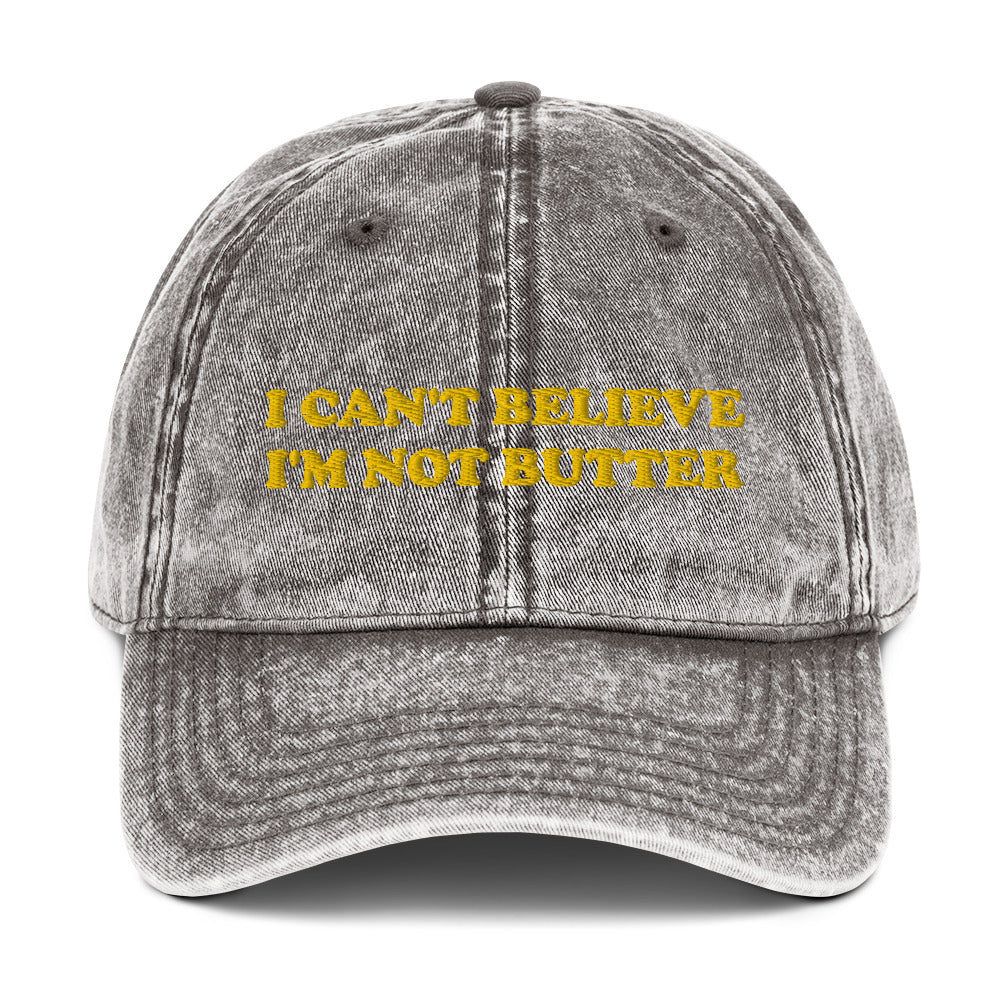 Gray Hat with funny saying - Make a statement in this cotton dad hat with "I can't believe I'm not butter", expertly embroidered on the front. It's a funny hat that is sure to have people asking, "Where'd you get that hat?" Looking for something personalized? Shoot us an email!