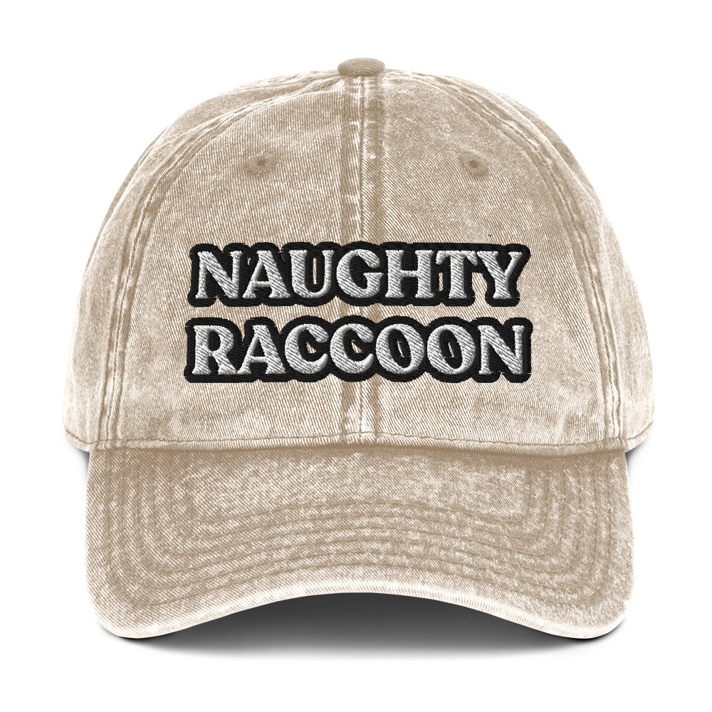 Tan unisex dad hat for raccoon lovers - from Nina's Funky Shop by ninanush - Stand out in this naughty raccoon hat. It's a vintage style embroidered dad hat with the words "naughty raccoon" in black and white on the front. This unique hat for raccoon enthusiasts is funny and just a little weird. Add a little personality to your everyday style or give it as a funny gift for a raccoon lover.