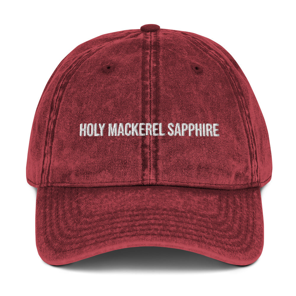 Maroon holy mackerel sapphire dad hat from Nina's Funky Shop by ninanush - HOLY MACKEREL SAPPHIRE! This vintage style dad hat comes in a variety of colors with the words "Holy Mackerel Sapphire" expertly embroidered on the front. It's a comfortable, vintage style dad hat with a funny saying. Add a little personality to your everyday outfit with this weird dad hat that's designed by Nina and made just for you.
