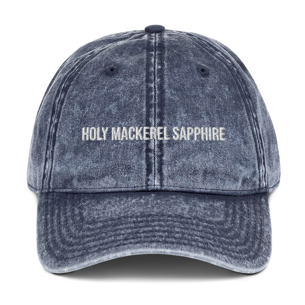 Blue holy mackerel sapphire dad hat from Nina's Funky Shop by ninanush - HOLY MACKEREL SAPPHIRE! This vintage style dad hat comes in a variety of colors with the words "Holy Mackerel Sapphire" expertly embroidered on the front. It's a comfortable, vintage style dad hat with a funny saying. Add a little personality to your everyday outfit with this weird dad hat that's designed by Nina and made just for you.