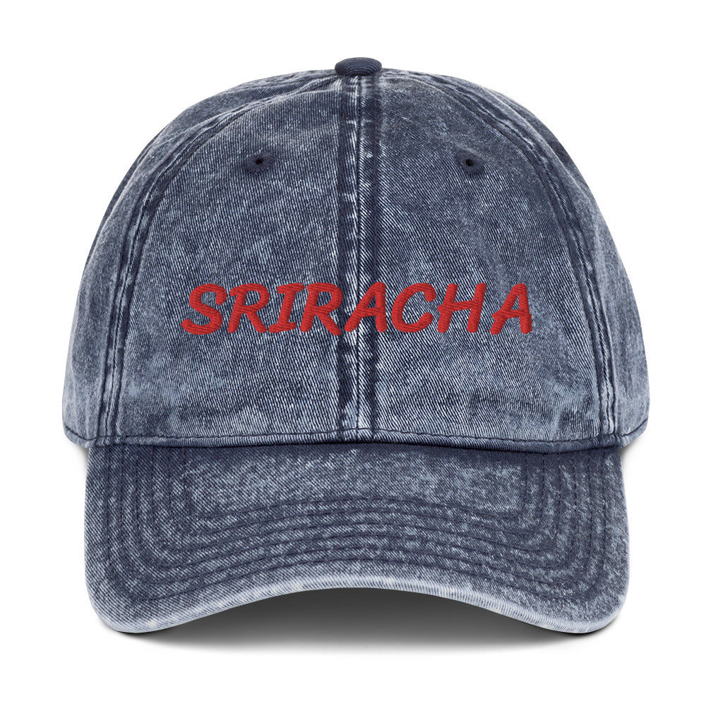 Blue sriracha dad hat from Nina's Funky Shop by ninanush - The Sriracha dad hat! Show your love for the beloved hot chili sauce in this funny foodie dad hat. It's comfortable with the word "Sriracha", embroidered on the front. It's a unique accessory that brings personality to your everyday outfits. Stay funky and eat your favorite hot sauce in this sriracha enthusiast hat.