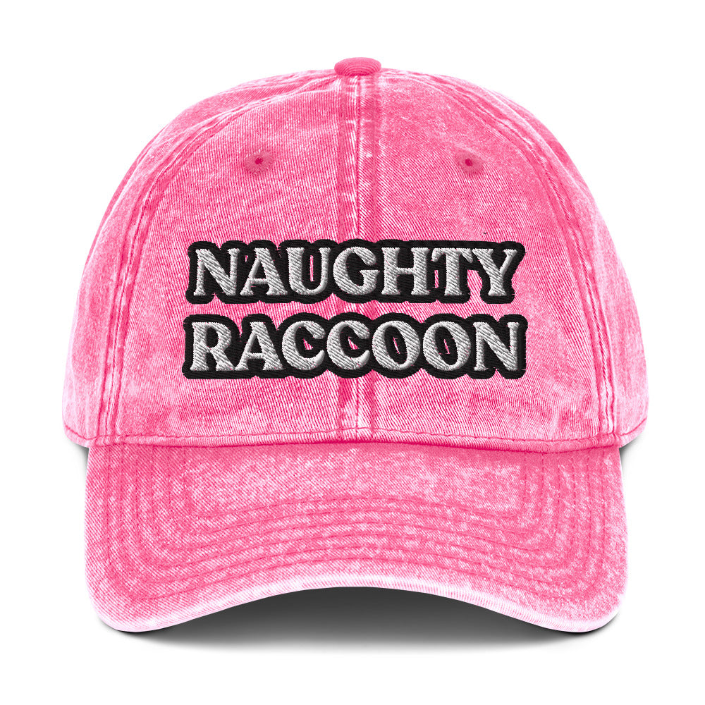 Pink unisex naughty raccoon dad hat from Nina's Funky Shop by ninanush - Stand out in this naughty raccoon hat. It's a vintage style embroidered dad hat with the words "naughty raccoon" in black and white on the front. This unique hat for raccoon enthusiasts is funny and just a little weird. Add a little personality to your everyday style or give it as a funny gift for a raccoon lover.