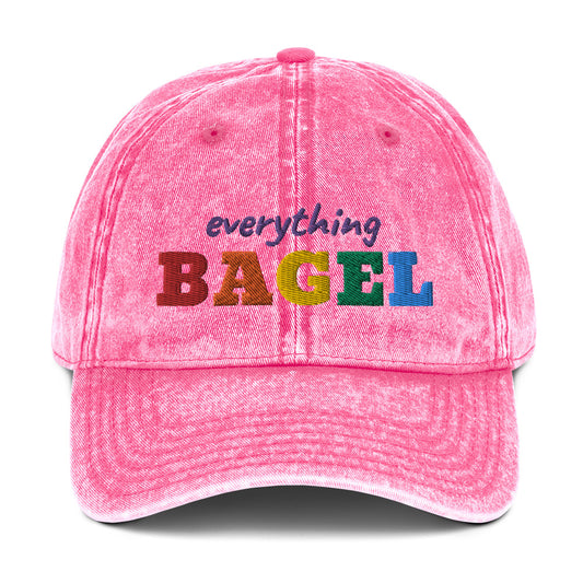 Pink Pride Hat for Bagel Lovers - Our Everything Bagel Pride Hat is comfortable, has an adjustable closure, and comes in a variety of colors with a funny rainbow design for pride, expertly embroidered on the front. The perfect hat for pride month and for bagel lovers or all kinds. Celebrate your favorite foods in our funky foodie clothing and accessories. Designed by Nina and made just for you!