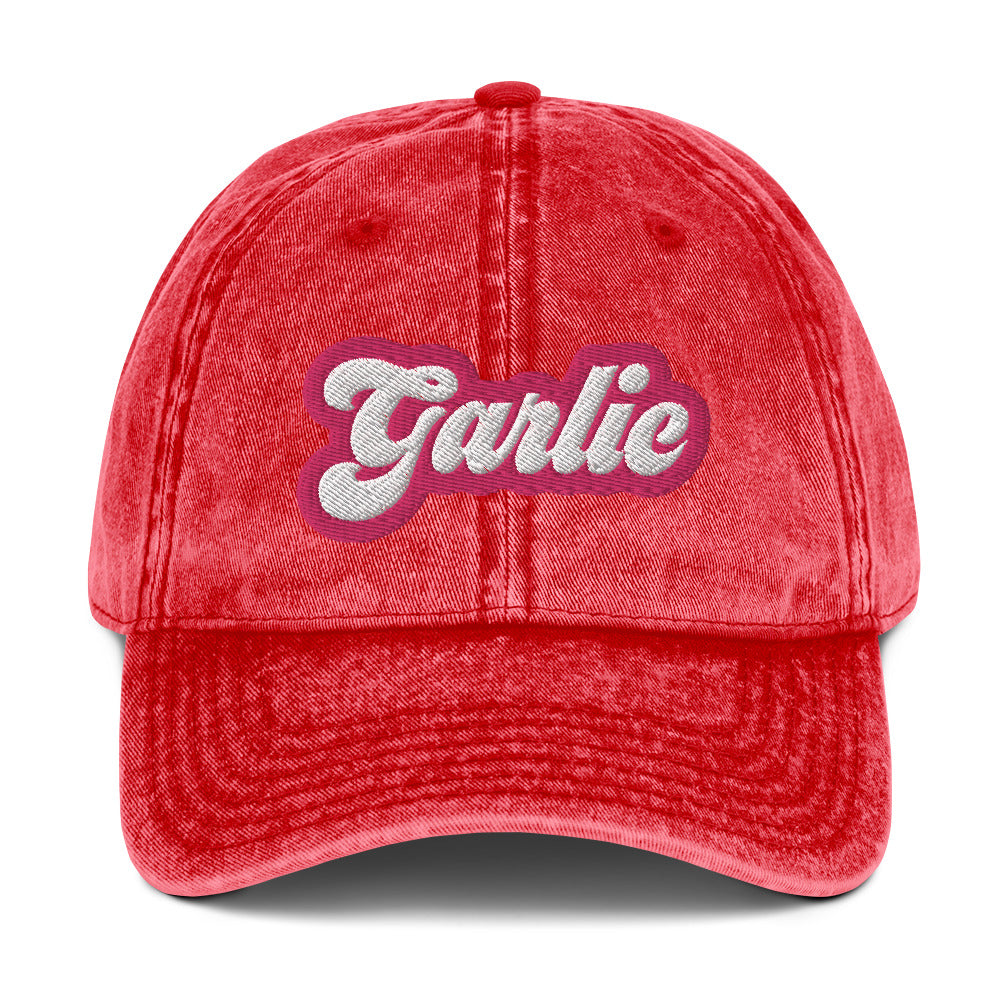 Red garlic dad hat - A colorful dad hat for garlic enthusiasts and foodies of all kinds. It's a vintage style dad hat with the word "garlic" embroidered in pink and white. A funny statement hat for garlic lovers to stand out and show off or a unique gift for your favorite garlic addict. This quirky dad hat is adjustable, weird and made just for you.