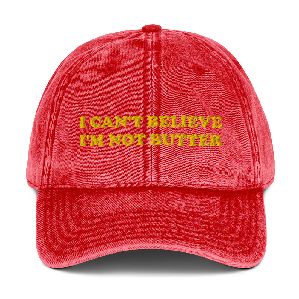 Red Hat with funny saying - Make a statement in this cotton dad hat with "I can't believe I'm not butter", expertly embroidered on the front. It's a funny hat that is sure to have people asking, "Where'd you get that hat?" Looking for something personalized? Shoot us an email!